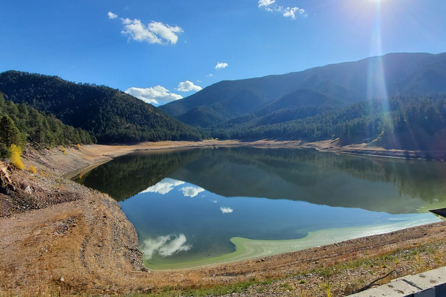 McClure Reservoir, surrounded by hills and trees.