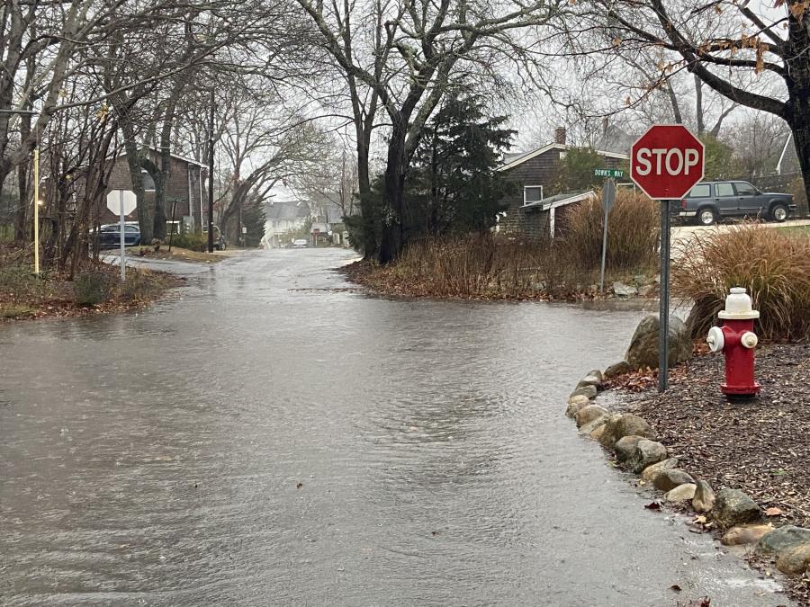 Flood waters cover a residential street.