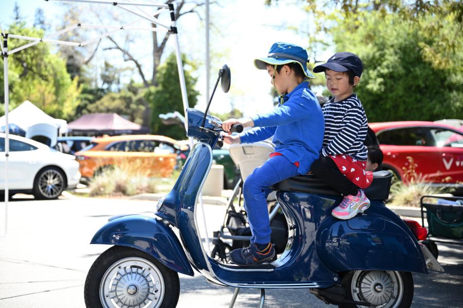 two children on a scooter
