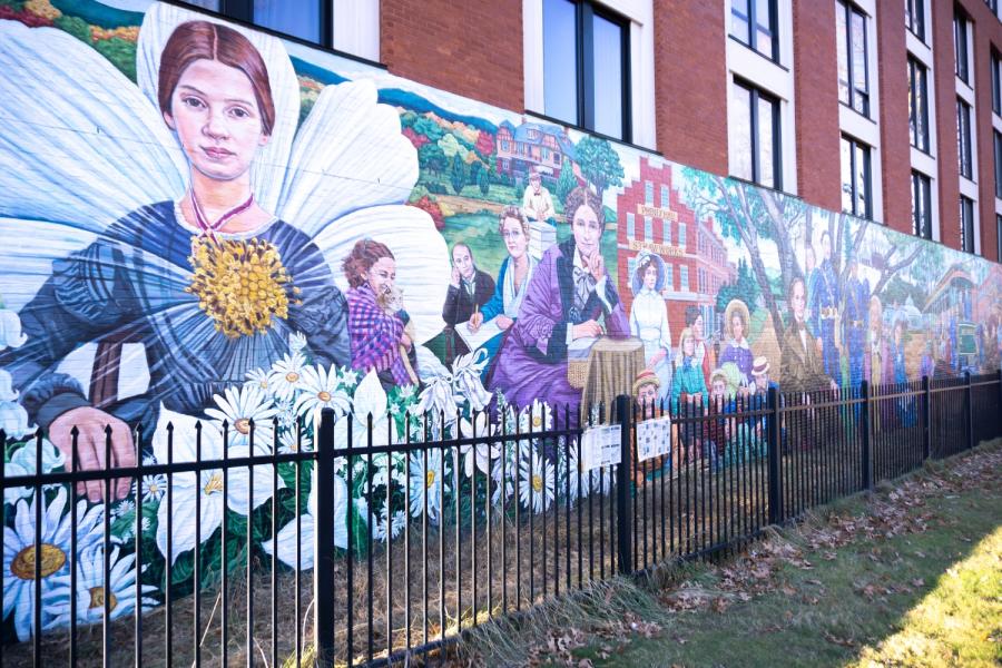 photo of the amherst history mural with a painting of emily dickinson in the forefront
