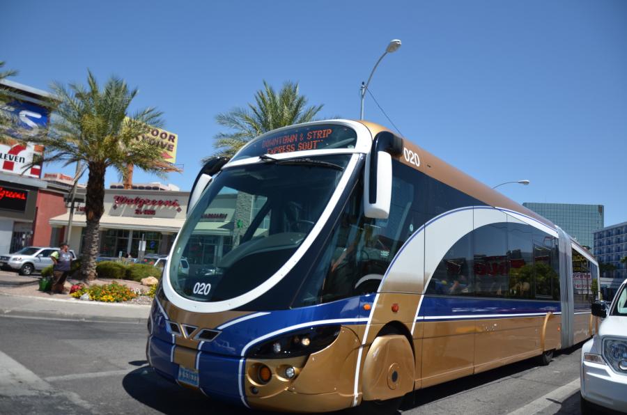 a city bus with destination "downtown & strip"