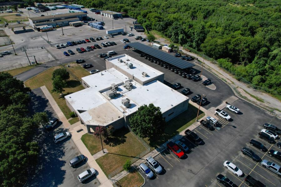 aerial photo of solar panels over parking lot