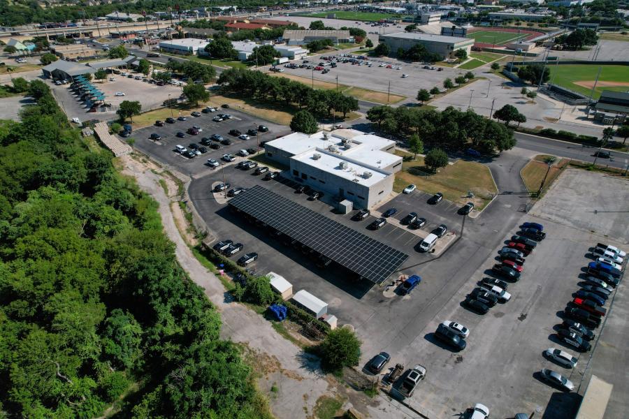 aerial photo of solar panels over parking lot