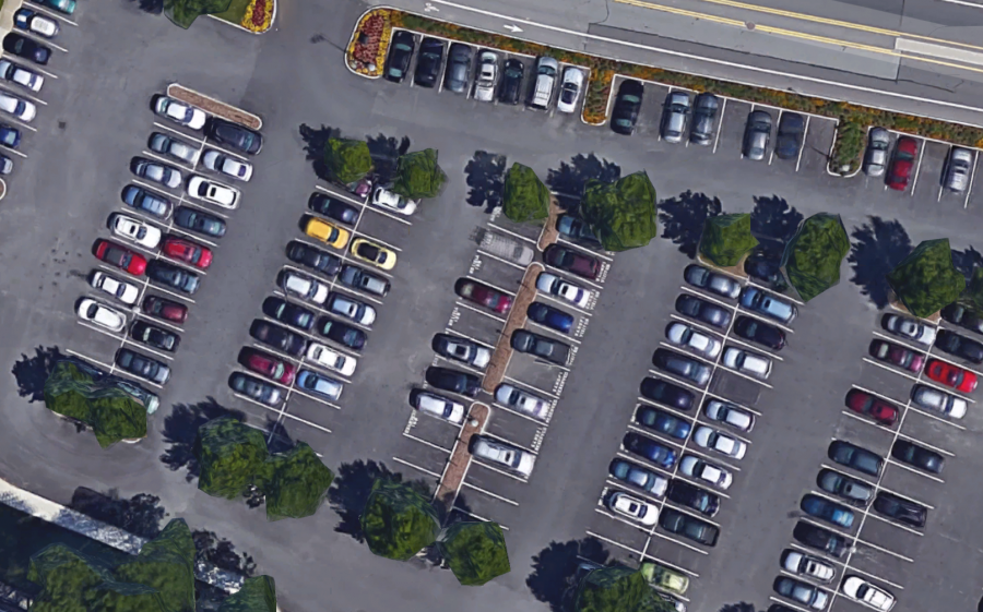 Overhead image of cars parked in a parking lot