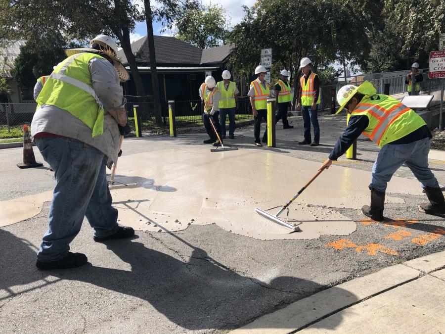 people installing cool pavement