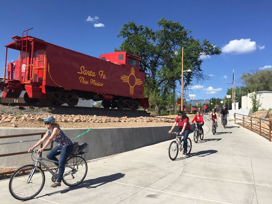 Bicyclists in front of caboose